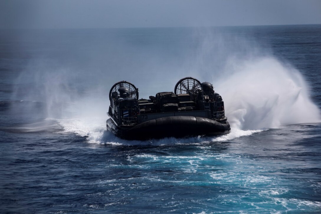 U.S. Navy Landing Craft, Air Cushion 73 with Assault Craft Unit 5, glides across the ocean during Composite Training Unit Exercise (COMPTUEX) off the coast of San Diego March 21, 2015. The LCAC was transporting Marines with Lima Company, Battalion Landing Team 3rd Battalion, 1st Marine Regiment, 15th Marine Expeditionary Unit back to the USS Essex (LHD-2) after training aboard San Clemente Island. (U.S. Marine Corps photo by Cpl. Elize McKelvey/Released)