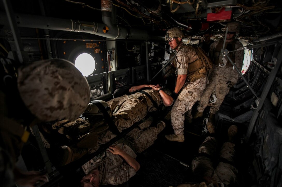 U.S. Marines with Combat Logistics Battalion 15, 15th Marine Expeditionary Unit, load simulated casualties onto an MV-22B Osprey during a mass casualty drill as part of Composite Training Unit Exercise (COMPTUEX) aboard the USS Essex (LDH 2) off the coast of San Diego March 22, 2014. CLB-15 is the MEU’s logistics combat element and provides both routine and emergency combat medical care for the more than 2,200 Marines. (U.S. Marine Corps photo by Cpl. Elize McKelvey/Released)