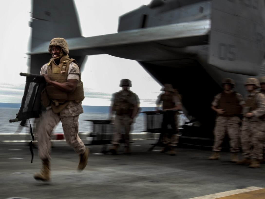 A U.S. Sailor with Combat Logistics Battalion 15, 15th Marine Expeditionary Unit, runs to the aid of simulated casualties during a mass casualty drill as part of Composite Training Unit Exercise (COMPTUEX) aboard the USS Essex (LDH 2) off the coast of San Diego March 22, 2014. CLB-15 is the MEU’s logistics combat element and provides both routine and emergency combat medical care for the more than 2,200 Marines. (U.S. Marine Corps photo by Cpl. Elize McKelvey/Released)