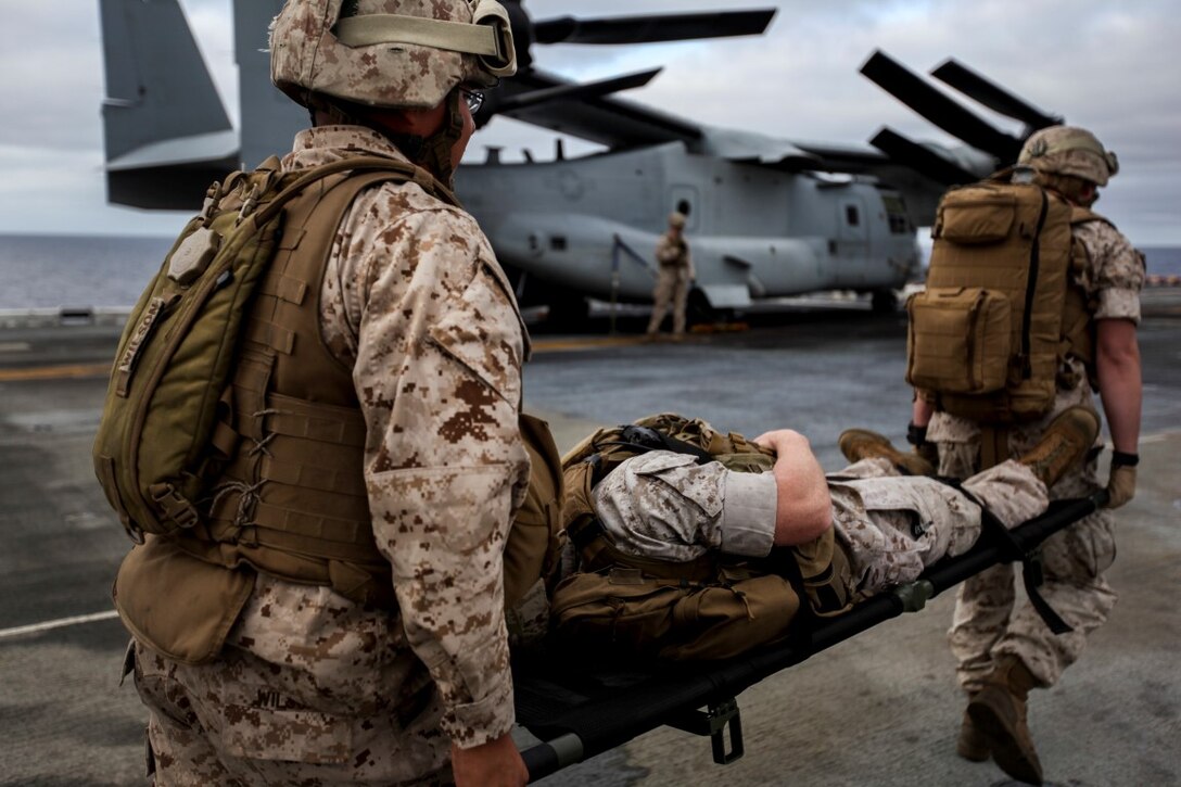 U.S. Marines with Combat Logistics Battalion 15, 15th Marine Expeditionary Unit, carry a simulated casualty for follow on evaluation during a mass casualty drill as part of Composite Training Unit Exercise (COMPTUEX) aboard the USS Essex (LDH 2) off the coast of San Diego March 22, 2014. CLB-15 is the MEU’s logistics combat element and provides both routine and emergency combat medical care for the more than 2,200 Marines. (U.S. Marine Corps photo by Cpl. Elize McKelvey/Released)