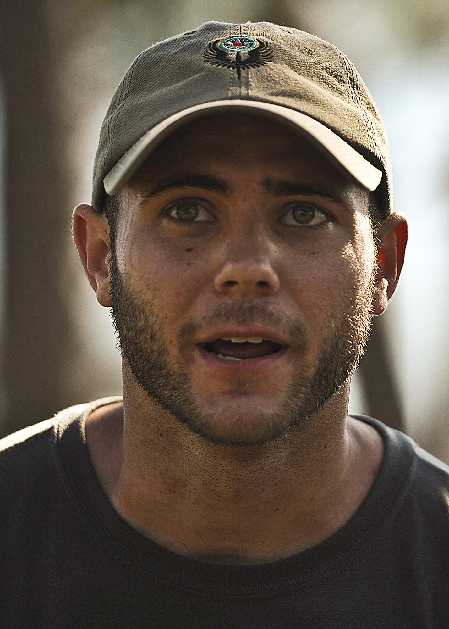 Staff Sgt. Luke Waldrop, 1st Special Operations Group detachment one, introduces himself after a 450-mile ruck march between MacDill Air Force Base to Hurlburt Field, Fla., March 20, 2015. The 11 Air Commandos carried flags with the names of the seven fallen Special Operations Command Marines and four Army National Guard air crew members that lost their lives during a training, March 10, 2015. (U.S. Air Force photo/Senior Airman Christopher Callaway/Released)