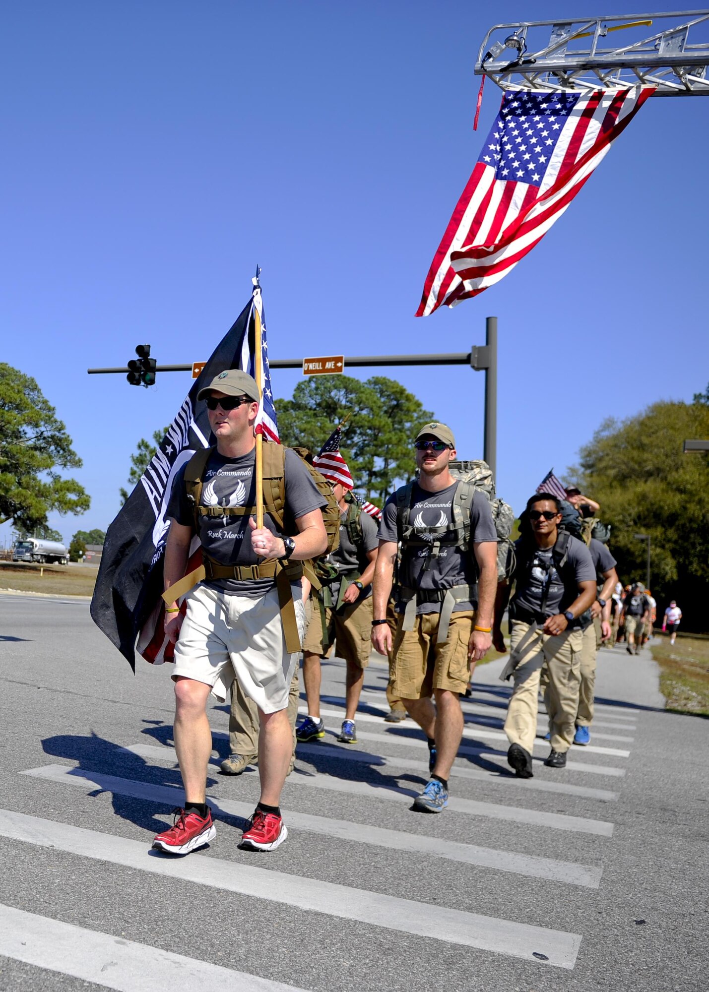 Airmen from the 1st Special Operations Wing arrive at Hurlburt Field, Fla., after a 450-mile ruck march that started at MacDill Air Force Base, Fla., March 20, 2015. The 11 Air Commandos carried flags with the names of the seven fallen Special Operations Command Marines and four Army National Guard air crew members that lost their lives during a training mission, March 10, 2015. (U.S. Air Force photo/Senior Airman Christopher Callaway/Released)