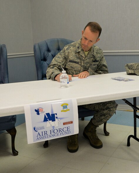 Col. Leland Bohannon, 2nd Bomb Wing vice commander, signs the first Air Force Assistance Fund donation slip on Barksdale Air Force Base, La., March 23, 2015. Over the next six weeks, AFAF representatives will meet with all Barksdale units to help reach the base goal of raising $75,000. (U.S. Air Force photo/Senior Airman Benjamin Raughton)
