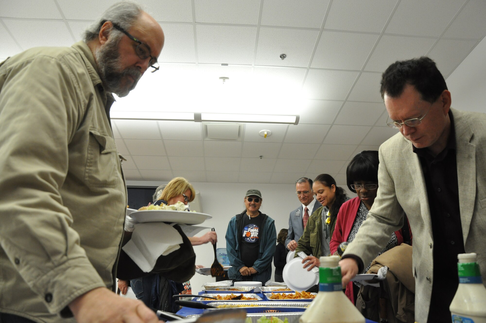 GOODFELLOW AIR FORCE BASE, Texas – Base and community members serve themselves from the meal line during the National Prayer Luncheon at the Taylor Chapel March 20. Before the lunch, the chapel provided a prayer session that hosted Muslim, Jewish and Christian readings and featured guest speaker Congressman Mike Conaway, 11th District of Texas. (U.S. Air Force photo/ Senior Airman Joshua Edwards)