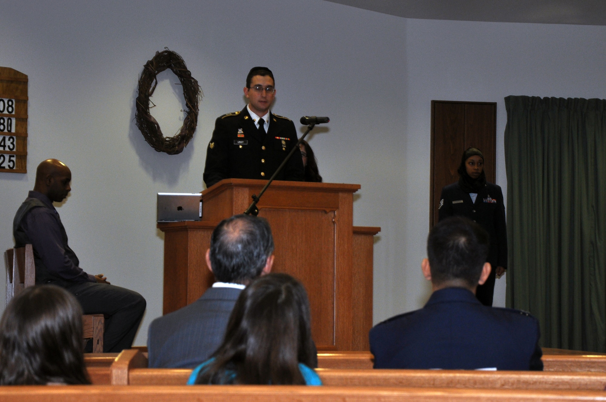 GOODFELLOW AIR FORCE BASE, Texas – Army Spc. Michael S. Urist, 344th Military Intelligence Battalion Bravo Company cryptologic language analyst, provides the Jewish sacred reading during the National Prayer Luncheon at the Taylor Chapel March 20. After base members provided Muslim, Jewish and Christian sacred readings, other individuals delivered the prayers for families, the deployed and the nation. (U.S. Air Force photo/ Senior Airman Joshua Edwards)