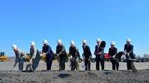 From left, Lt. Col. Scott Bryant, 436th Civil Engineer Squadron commander, Col. Brian May, Air Force Civil Engineer Center Facility Engineering director, John Bonapart, Air Mobility Command Installations and Mission Support director, Col. Raymond Kozak, 512th Airlift Wing commander, Col. Michael Grismer, 436th AW commander, Paul Hoeper, Versar Inc. Chairman of the Board, Sen. Tom Carper, D-Del., Sen. Chris Coons, D-Del., and Rep. John Carney D-Del., ceremonially shovel dirt at a Runway Repair Groundbreaking ceremony March 23, 2015, at Dover Air Force Base, Del. The $98.3 million project is projected to be complete in June 2016. (U.S. Air Force photo/Airman 1st Class William Johnson)