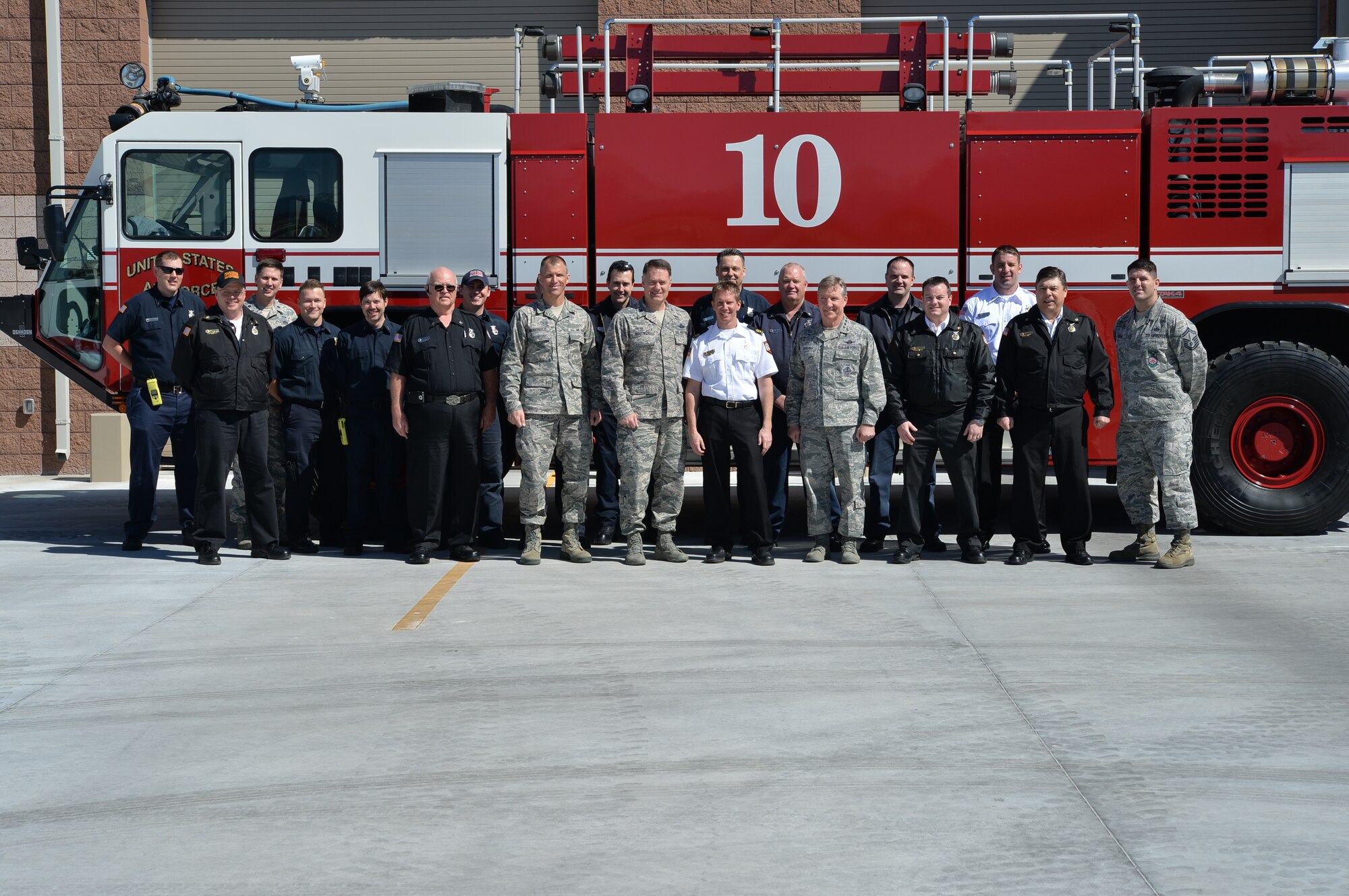U.S. Air Force Gen. Hawk Carlisle, commander of Air Combat Command, center right, joins the Nellis-Creech Fire Emergency Services Flight for a group photo after the ribbon cutting for Fire Station 6 on March 4, 2015, at Creech Air Force Base, Nevada. The new facility will keep the unit’s mission in line with DoD emergency time and distance response mandates, where 'response time' is most often the critical factor in successful emergency mitigation.  (U.S. Air Force photo by Senior Airman Adarius Petty/Released)   