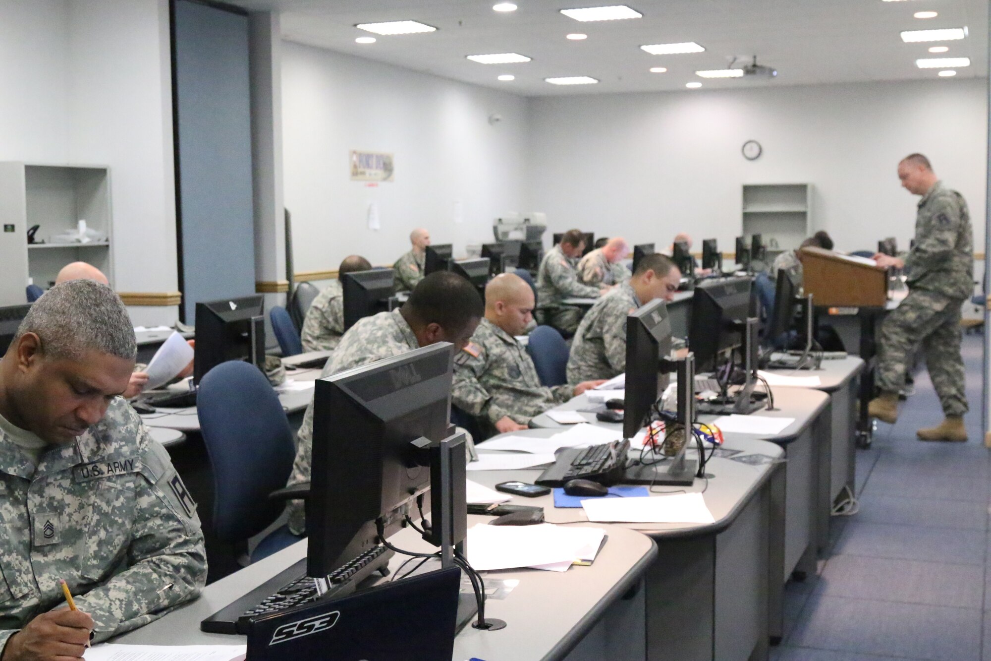 174th Infantry Brigade noncommissioned officers review a practical exercise during this month's Battle Staff NCO Course held at the Army Support Activity-Dix Distance Learning Center on Joint Base McGuire-Dix-Lakehurst, N.J., March 10, 2015. (U.S. Army photo by Maj. Antonia Greene-Edwards/Released)