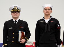 Naval Nuclear Power Training Command staff and students recognize Ensign Dustin Swanson and Machinist’s Mate 3rd Class Steven Penczner as the top officer and enlisted honor graduates during the Nuclear Power School Class 1407 graduation ceremony on March 20 in Goose Creek, SC. More than 1,200 staff members, students, family and friends gathered to honor the class before their transition to future duty stations. (US Navy photo by Electrician’s Mate 3rd Class Jett Supler)