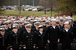 More than 1,200 Naval Nuclear Power Training Command staff members, students, family and friends attend the Nuclear Power School Class 1407 graduation ceremony on March 20 in Goose Creek, SC. Officers and enlisted students look on as classmates begin their transition to future duty stations. (US Navy photo by Electrician’s Mate 3rd Class Jett Supler)