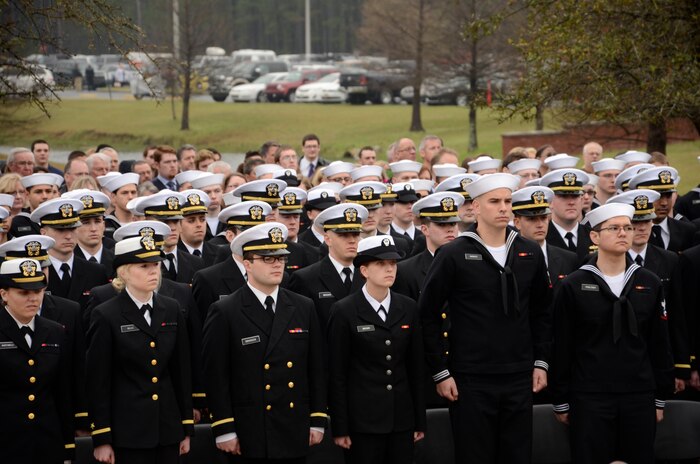 More than 1,200 Naval Nuclear Power Training Command staff members, students, family and friends attend the Nuclear Power School Class 1407 graduation ceremony on March 20 in Goose Creek, SC. Officers and enlisted students look on as classmates begin their transition to future duty stations. (US Navy photo by Electrician’s Mate 3rd Class Jett Supler)