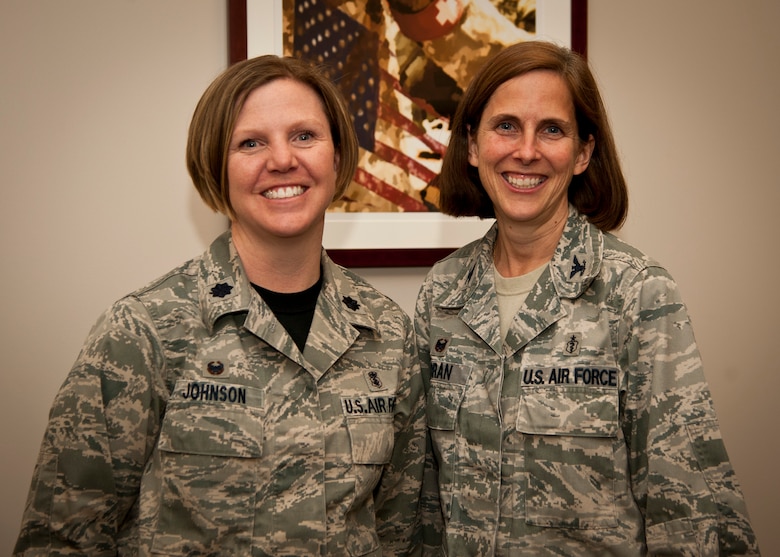 PETERSON AIR FORCE BASE, Colo. – Lt. Col. Tamra Johnson (left), 21st Medical Operations Squadron commander, and Col. Susan Moran, 21st Medical Group commander, pose for a photo in the 21st MDG annex building. Moran and Johnson first met during initial training at Lackland AFB, Texas, and have served more than 40 combined years in the Air Force. Both Moran and Johnson only planned to serve their initial commitments, but have continued in service of their nation excelling in their respective specialties. (U.S. Air Force photo/Staff Sgt. J. Aaron Breeden)