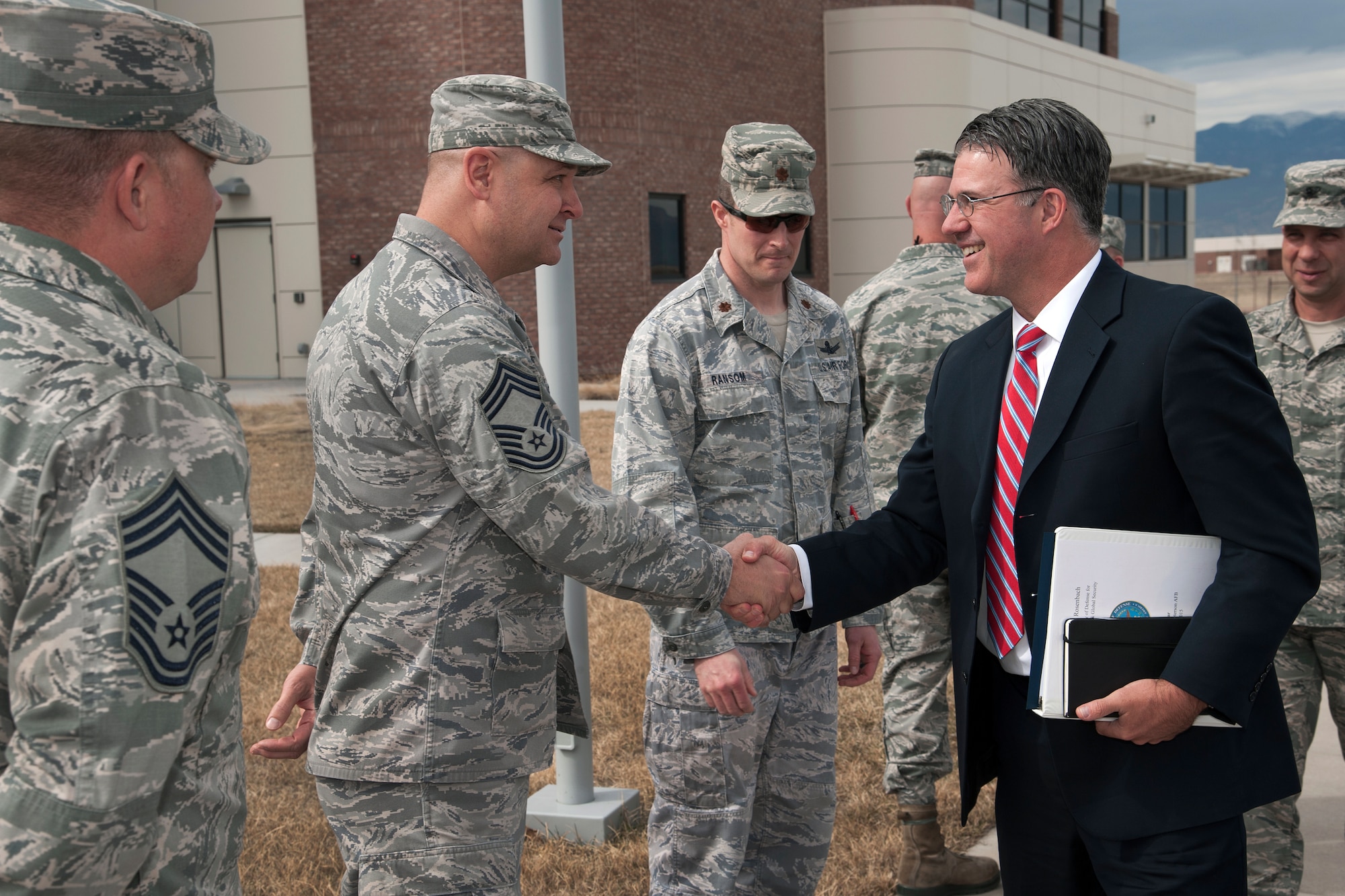 PETERSON AIR FORCE BASE, Colo. – Chief Master Sgt. Carl Grieser, 4th Space Control Squadron, greets Eric Rosenbach, assistant secretary of defense for Homeland Defense and Global Security, during his visit to the 4th SPCS March 18. During his visit, Rosenbach received a Wing and 4th SPCS mission brief, and toured the space control campus. (U.S. Air Force photo by Craig Denton)