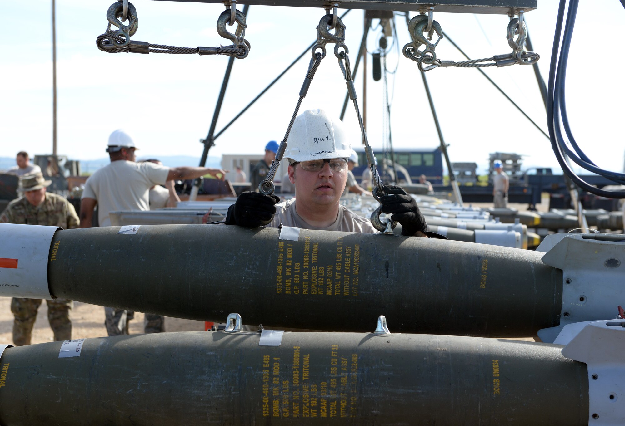 Staff Sgt. Cory Mauer, 18th Munitions Squadron munitions accountability supervisor, Kadena Air Base, Japan, lowers MK-82 ammunition at Beale Air Force Base, Calif., March 17, 2015. Mauer was attending the Combat Ammunition Planning and Production course at the Air Force Combat Ammunition Center located on Beale Air Force Base. (U.S. Air Force photo by Senior Airman Bobby Cummings/Released)