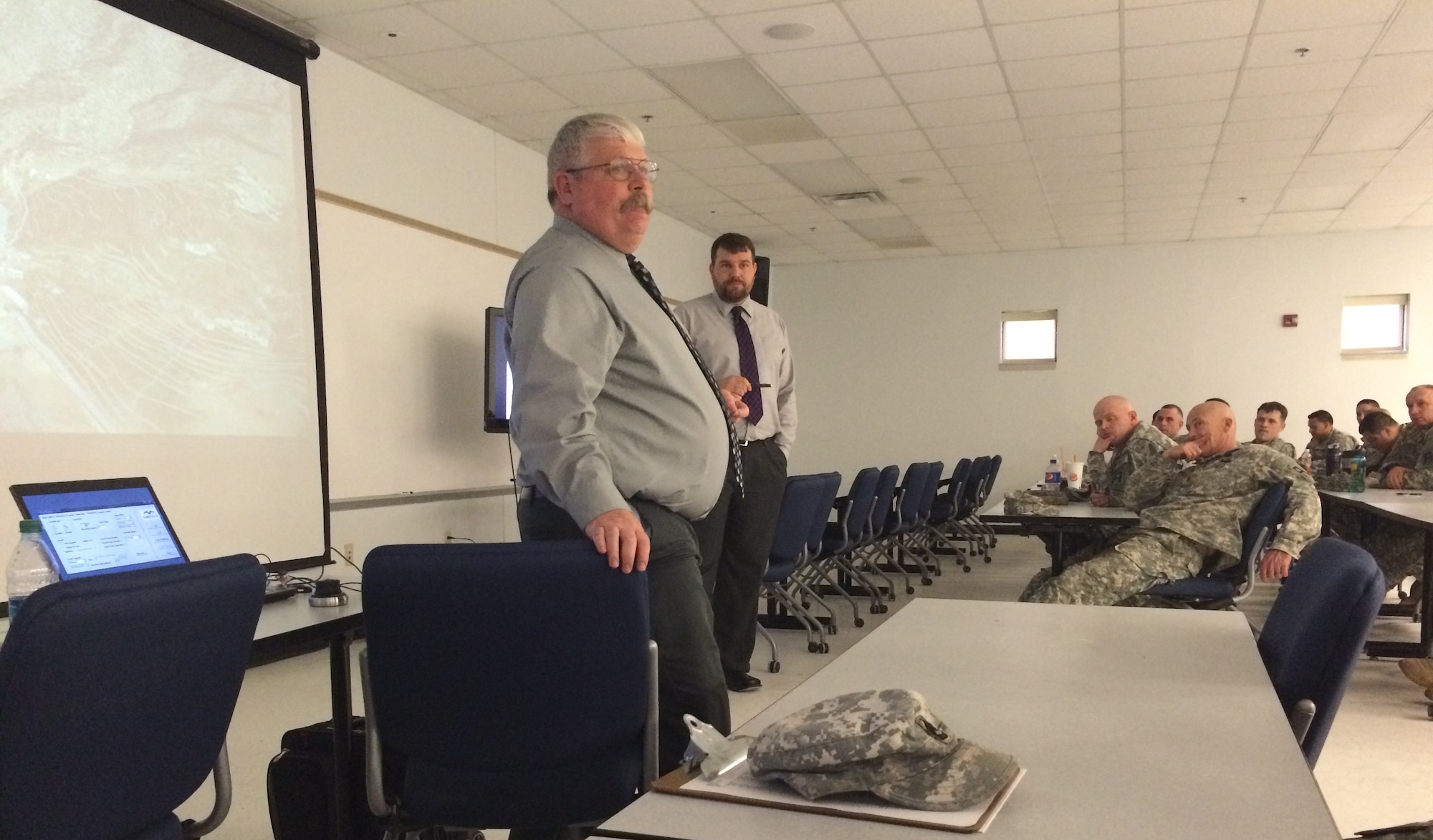Dr. Curtis King and Florian Waitl, Combat Studies Institute historians, based in Fort Leaven worth, Kan., demonstrate the Virtual Staff Ride capabilities to the combined audience of 174th Infantry Brigade and 72nd Field Artillery Brigade leaders at Army Support Activity Dix on Joint Base McGuire-Dix-Lakehurst, N.J., March 12, 2015. (U.S. Army photo by Maj. Antonia Greene-Edwards/Released)