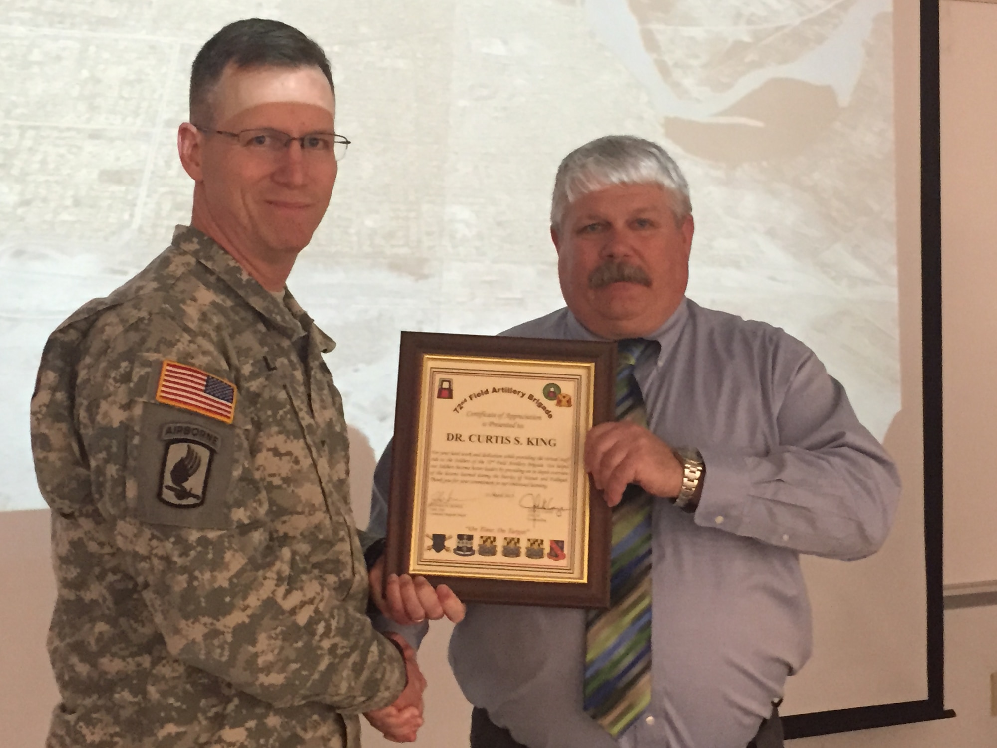 Army Col. John K. Lange, 72nd Field Artillery Brigade commander, recognized Dr. Curtis King, Combat Support Institute historian, for his leadership on the unit's first Virtual Staff Ride held at Army Support Activity Dix on Joint Base McGuire-Dix-Lakehurst, N.J., March 10-13, 2015. (U.S. Army photo by Maj. Antonia Greene-Edwards/Released)