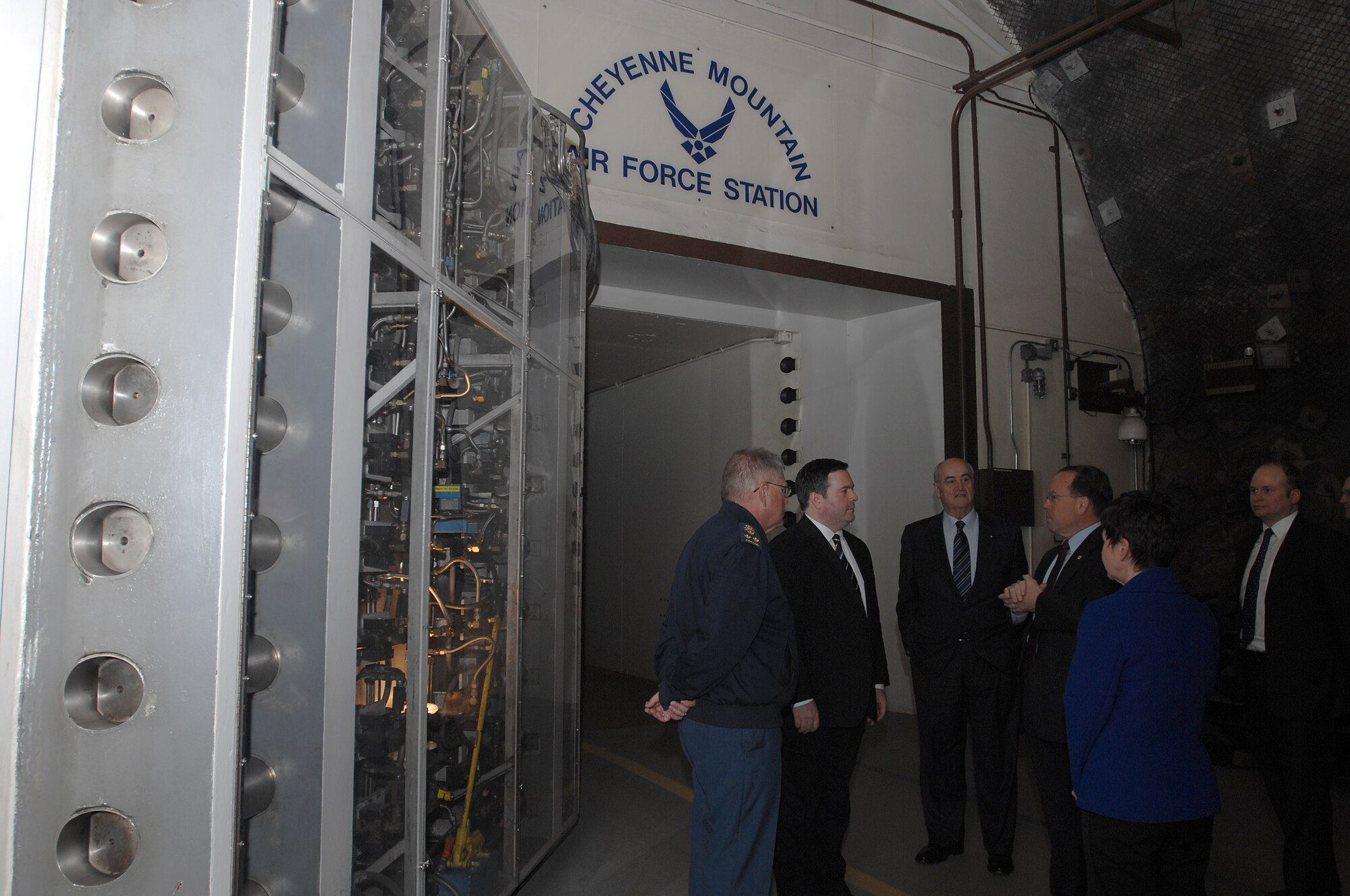 CHEYENNE MOUNTAIN AIR FORCE STATION, Colo. – Steve Rose, 721st Mission Support Group deputy director, details the 721st MSG’s mission to Canadian Defence Minister Jason Kenney and Associate Defence Minister Julian Fantino March 16 during their first trip to Cheyenne Mountain Air Force Station. The Canadian Joint Operations Command, NORAD and USNORTHCOM share the task of defending North America, and the 721st MSG hosts NORAD’s alternate command center at CMAFS. (Courtesy photo)