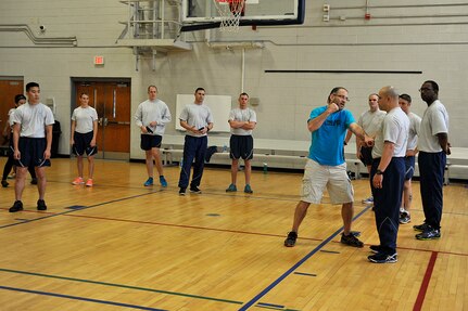 Members of Joint Base Charleston attend a Krav Maga class as part of a wingman day. Focused on a wide variety of topics offered at the Naval Weapons Station and the Air Base, Mar. 20, 2015, Wingman Day University was implemented this year. Wingman day offers Airmen and personnel several classes on resiliency including topics such as finances, stress management, fitness, nutrition and resiliency.  (U.S. Air Force photo/Tech. Sgt. Renae Pittman)