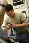 Airman 1st Class Jacob O’Leary, 91st Missile Operations Squadron facilities maintenance team member, performs a periodic maintenance inspection and repair of the air handler during training on Minot Air Force Base, N.D., March 3, 2015. FMT instructors provide instruction to produce competent facilities maintenance technicians that are able to perform periodic maintenance, troubleshoot, and repair diesel-electrical units and environmental control systems that sustain unmanned launch facilities. (U.S. Air Force photo/Senior Airman Brittany Y. Bateman)