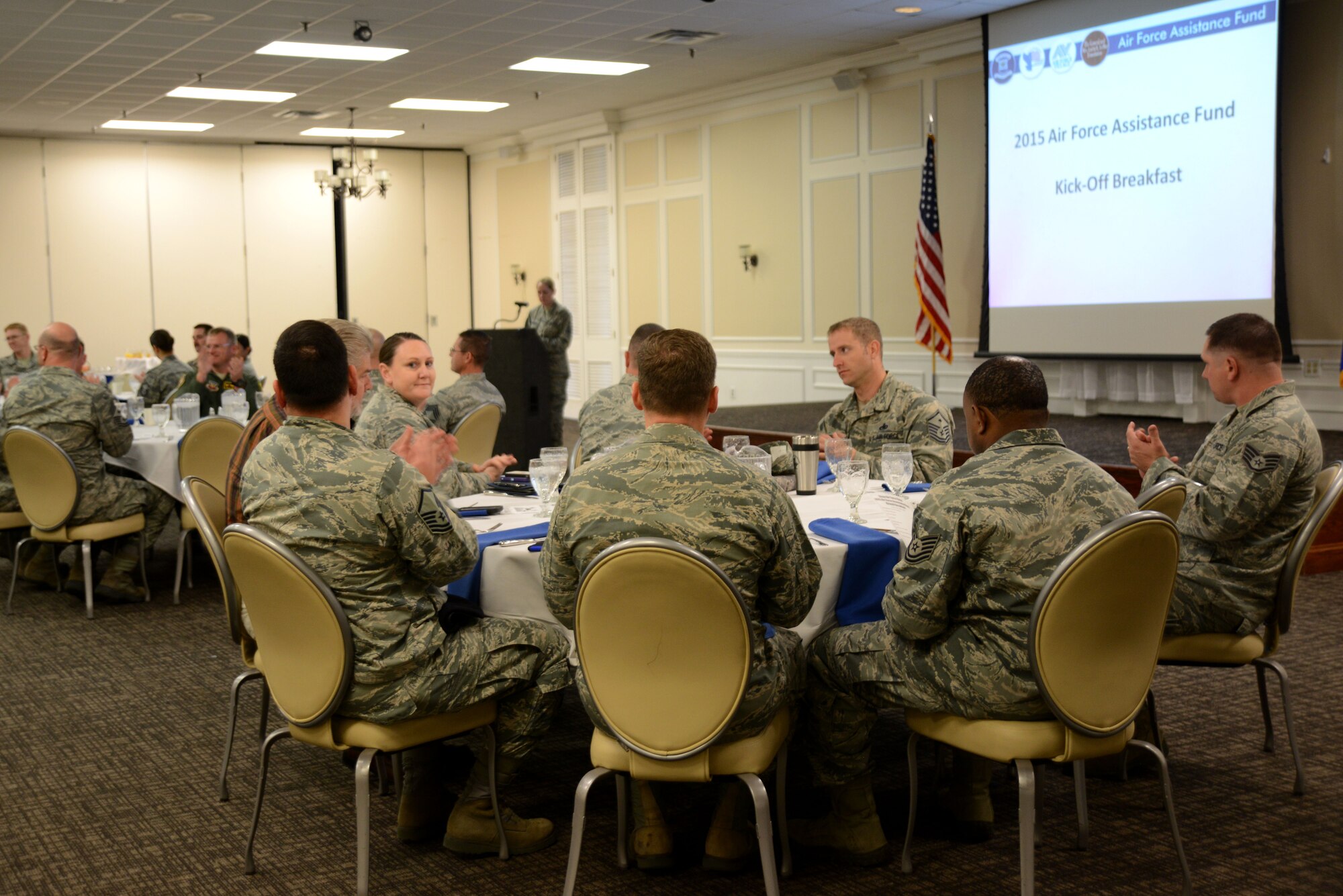 Members of Team Shaw eat breakfast while attending the 2015 Air Force Assistance Fund campaign kickoff event at Shaw Air Force Base, S.C., March 19, 2015. For 2015, Team Shaw’s goal is to raise more than $105,625 for the AFAF campaign. (U.S. Air Force photo by Airman 1st Class Michael Cossaboom/Released)
