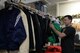 Tech. Sgt. John Dickson sorts men’s clothing at the Airman’s Attic on Scott Air Force Base, Illinois on March 12, 2015. The Airman’s Attic depends on volunteers to accept donations, sort them, place them on shelves, and assist customers. Everything at the Airman’s Attic is 100 percent free. Parr is a member of Command and Control at the 618th Air Operations Center. (U.S. Air Force photo by Senior Airman Sarah Hall-Kirchner/Released)