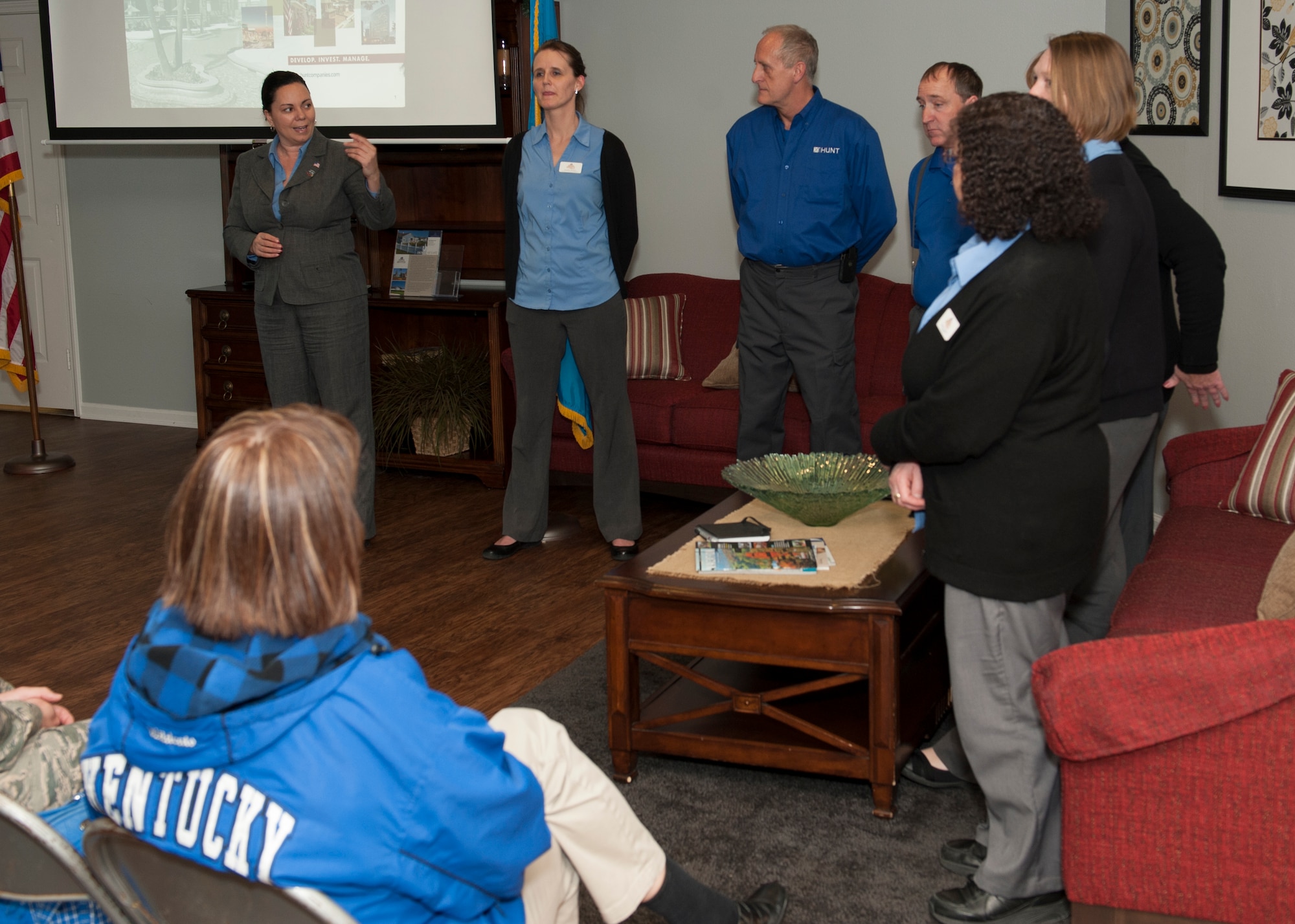 Sophia Reeves, Hunt Properties community director, left, introduces her team at the Community Information Meeting March 18, 2015, at the Hunt Properties Housing Office on Dover Air Force Base, Del. Community Information Meetings are held quarterly. (U.S. Air Force photo/Airman 1st Class Zachary Cacicia)