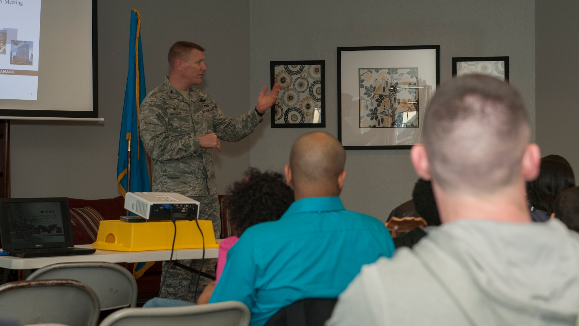 Col. Michael Grismer, 436th Airlift Wing commander, speaks during the Community Information Meeting March 18, 2015, at the Hunt Properties Housing Office on Dover Air Force Base, Del. Grismer and other base leadership attended the meeting to discuss new developments in Dover AFB housing. (U.S. Air Force photo/Airman 1st Class Zachary Cacicia) 