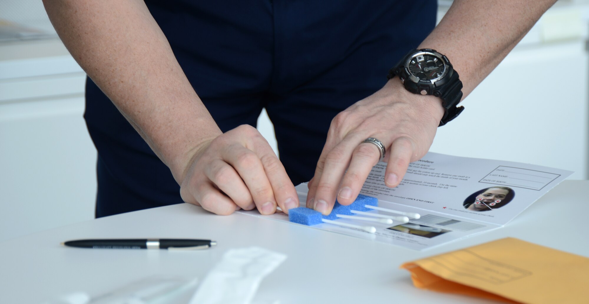 Tech. Sgt. Eric Masciulli puts his DNA sample packet together as part of the registry process for the DoD Marrow Donor program at the Air National Guard Readiness Center on Joint Base Andrews, Md., March 19, 2015. More than 6000 people have received potentially life-saving bone marrow transplants through the program since its inception. (U.S. Air National Guard photo by Senior Airman John E. Hillier/Released)