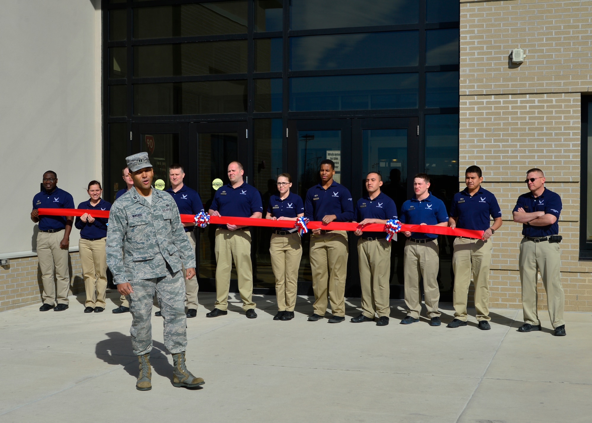 Capt. Walter Wingard, Jr., 436th Force Support Squadron Sustainment Flight commander, speaks at a ribbon cutting ceremony outside of the fitness center March 18, 2015, at Dover Air Force Base, Del. The ceremony marked the  official transition of the fitness center to a 24-hour, seven days per week schedule, allowing all Airmen the opportunity to work out around the clock and achieve their fitness goals. (U.S. Air Force photo/Airman 1st Class William Johnson)