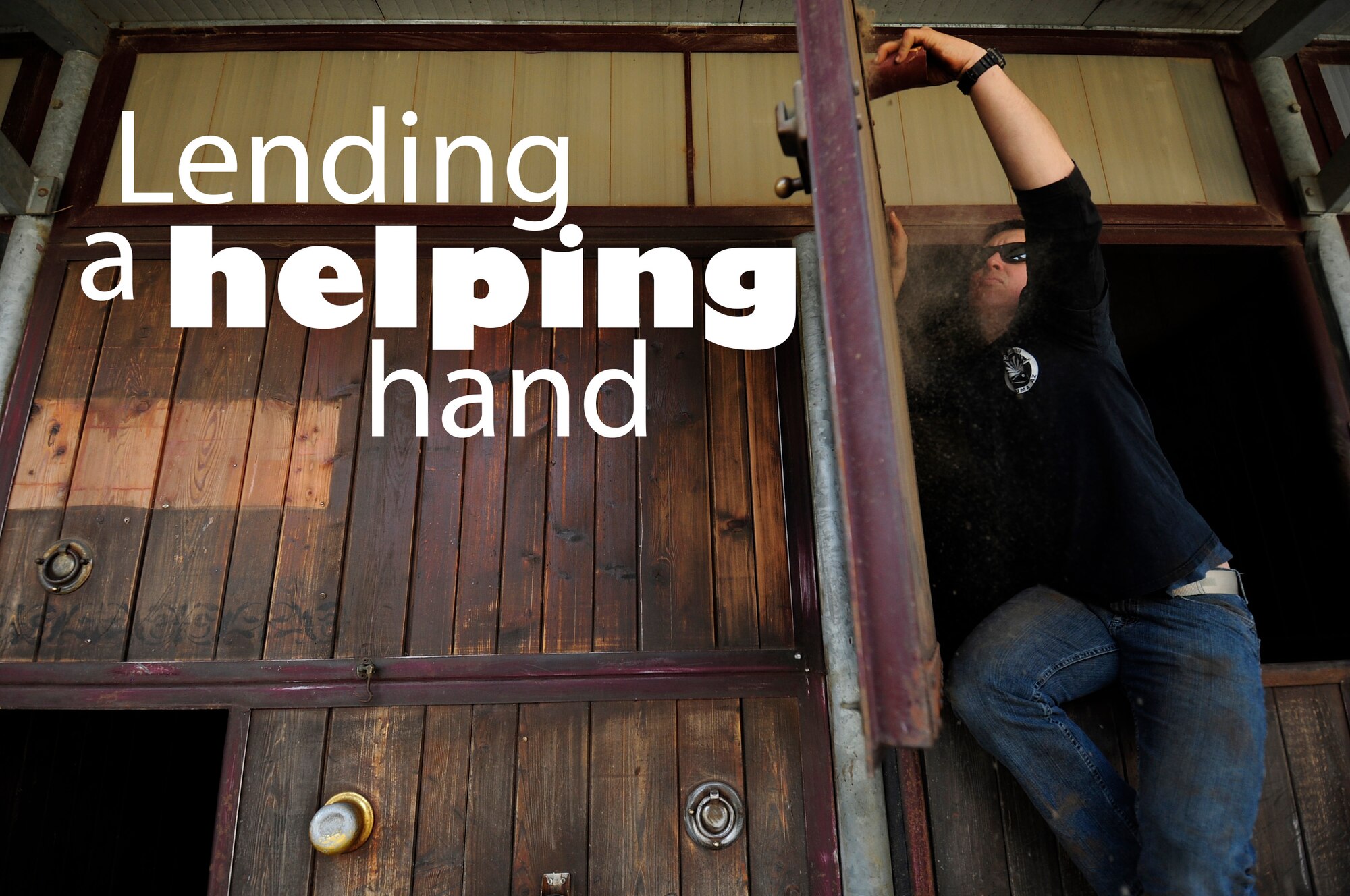 U.S. Air Force Staff Sgt. Cody Sapp, 31st Maintenance Squadron crew chief, sands down a horse stall before painting it March, 15, 2015 in Porcia, Italy. A group of more than 10 Airmen volunteered to help a local a therapeutic horse-riding center. The center helps children, teenagers and adults with motor, cognitive and emotional difficulties through horse therapy. (U.S. Air Force photo illustration by Staff Sgt. Evelyn Chavez/Released)   