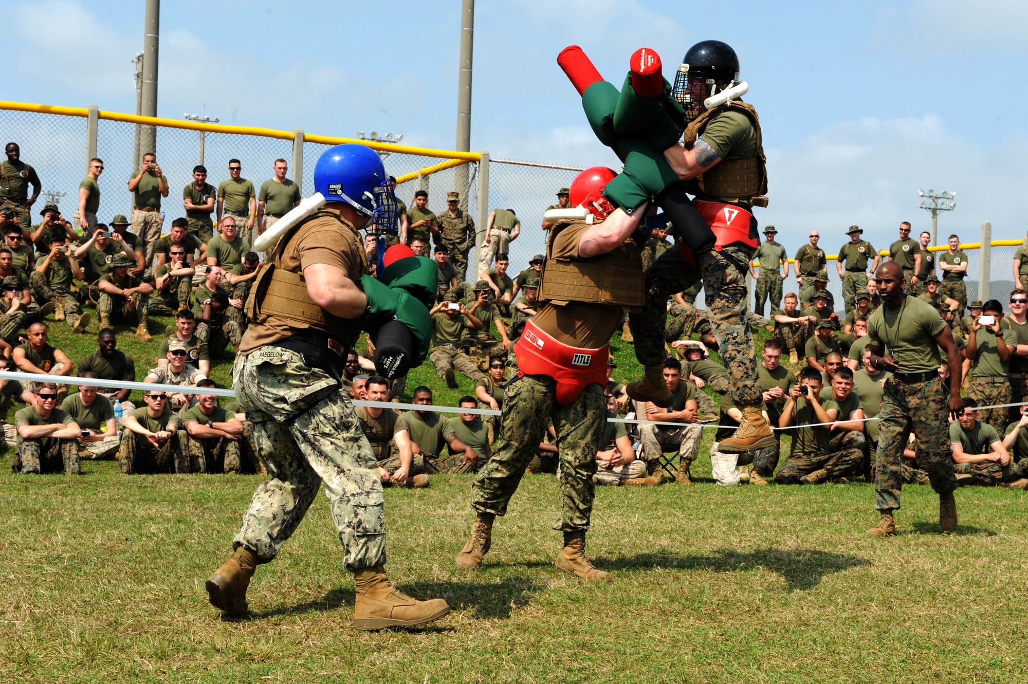 Members of Naval Mobile Construction Battalion 5 and the 3rd Marine Division Combat Assault Battalion compete in a pugal stick match on Camp Hansen, Japan, March 20, 2015. Every year engineering units compete in competitive demonstrations of athleticism and resourcefulness in honor of St. Patrick, the patron saint of engineers. More than 500 Airmen, Marines and Sailors participated in this year’s annual competition but only the 172nd Marine Wing Support Squadron was able to take home the trophy. (U.S. Air Force photo by Airman 1st Class Stephen G. Eigel)