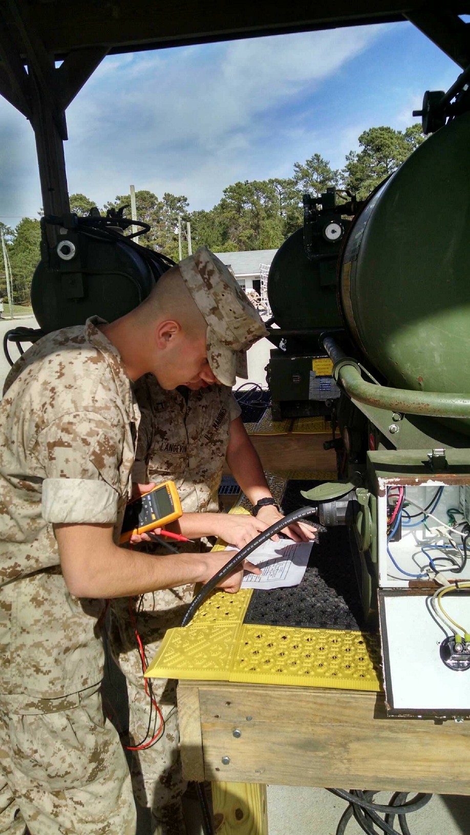 Marines from BEEEST 4-15 learn to troubleshoot the electrical components of the M80 water heater.