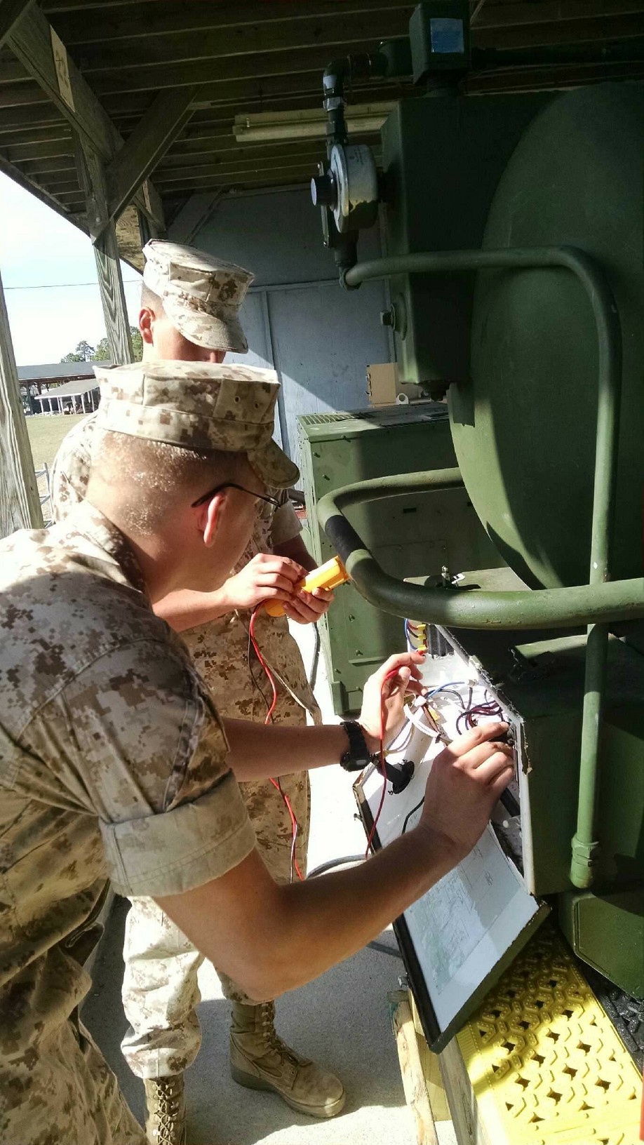 Marines from BEEEST 4-15 learn to troubleshoot the electrical components of the M80 water heater.