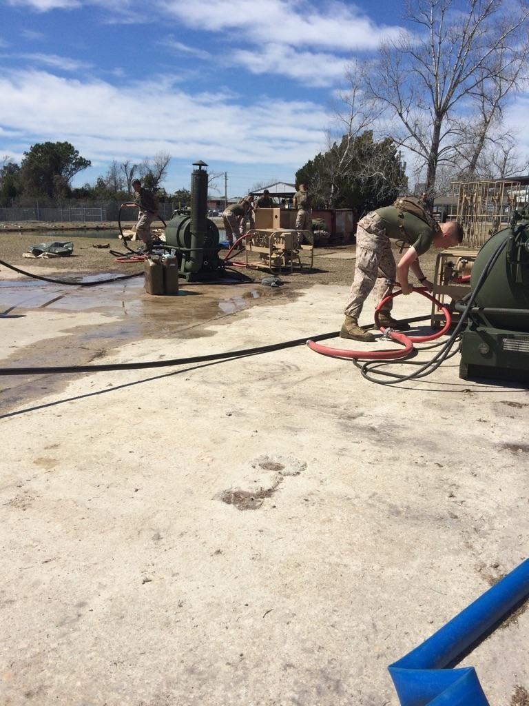 Marines from BWST 5-15 learn to set up and prepare Bare Base Shower Units for operation.