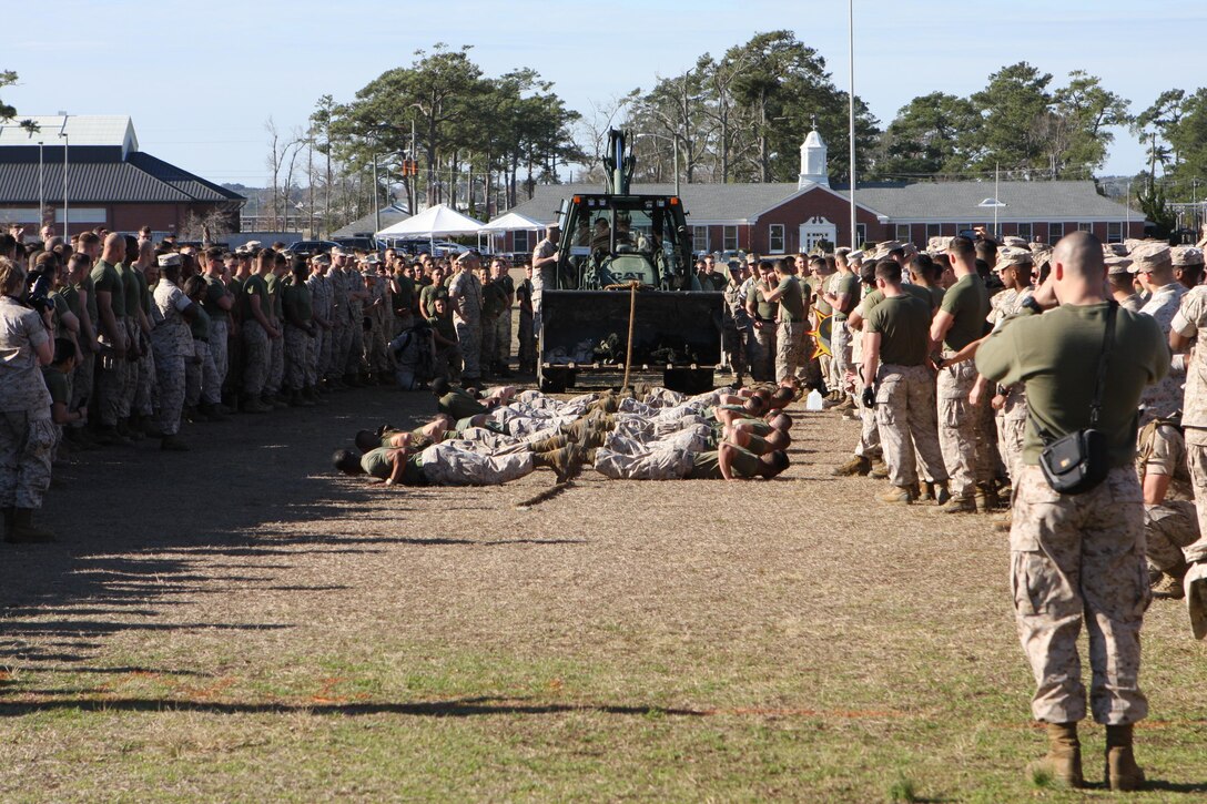 Marines at the annual St. Patrick’s Day Engineer Field Meet, on Ellis Field, aboard Marine Corps Base Camp Lejeune, North Carolina, March 12, 2015 prepare to compete in the backhoe loader pull.