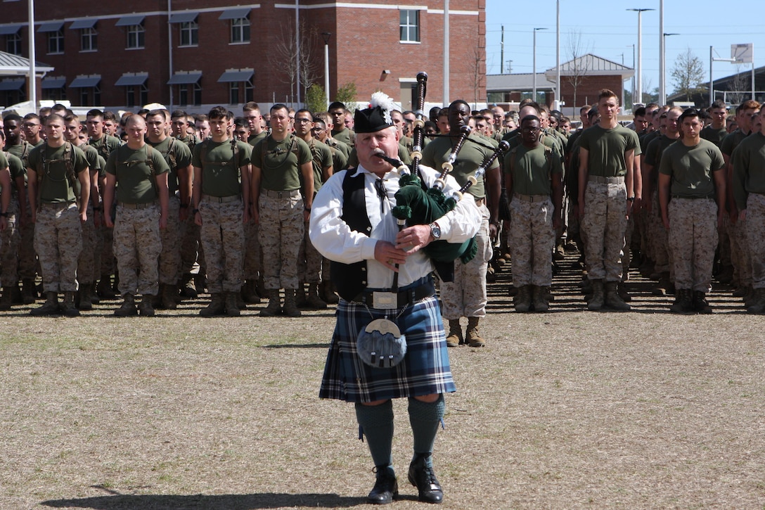 A bagpiper closes out the annual St. Patrick’s Day Engineer Field Meet, on Ellis Field, aboard Marine Corps Base Camp Lejeune, North Carolina, March 12, 2015 by playing the Marines' Hymn.