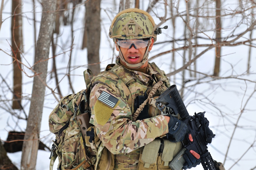 Air Force Senior Airman Joel Ramirez moves towards an objective during a helicopter close air support training exercise on Fort Drum, N.Y., March 14, 2015. Ramirez is assigned to the New York National Guard's 274th Air Support Operations Squadron.