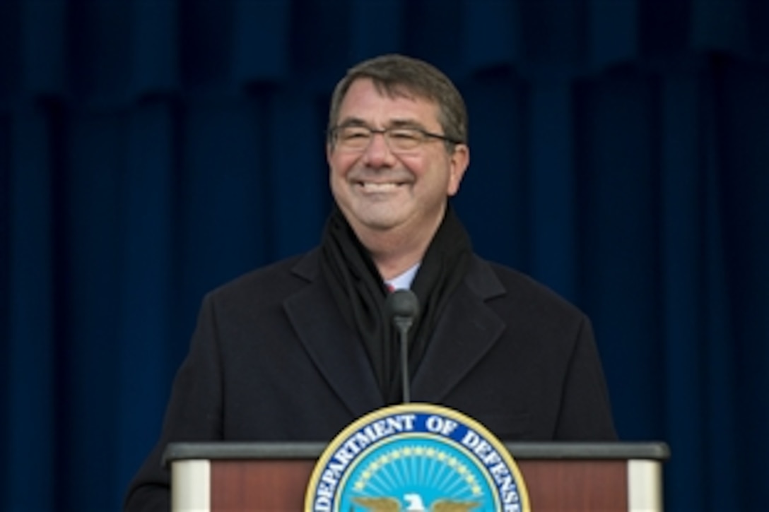 U.S. Defense Secretary Ash Carter shares a light moment with the crowd as he speaks in the Pentagon center courtyard while hosting Afghan President Ashraf Ghani and Chief Executive Abdullah Abdullah for a visit, March 23, 2015. Carter and Ghani both delivered remarks, thanking service members and veterans who served in Afghanistan for their efforts and sacrifices.