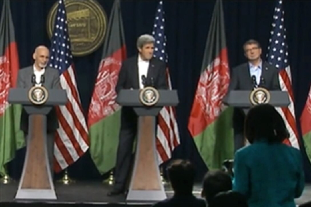 U.S. Defense Secretary Ash Carter, right, Afghan President Ashraf Ghani, left, and U.S. Secretary of State John F. Kerry listen to a reporter's question during a press conference on Camp David., Md., 2015. Carter earlier hosted Ghani and Afghan Chief Executive Abdullah Abdullah for a visit at the Pentagon, where Ghani thanked service members and veterans who served in Afghanistan for their efforts and sacrifices.