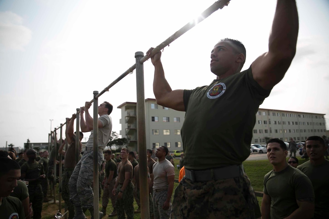 Marines, sailors and airmen compete in an engineer field-meet March 20 on Camp Hansen. The field-meet is an annual event engineers on Okinawa hold to celebrate St. Patrick’s Day. The Marines, sailors and airmen compete in multiple challenges throughout the day to see who the best company of engineers on Okinawa is. Some of the competitions include a tire-flip relay, an iron-man challenge, zodiac relay and a chariot race. The company that wins the most competitions by the end of the day receives a trophy that is passed down from the winners every year. 