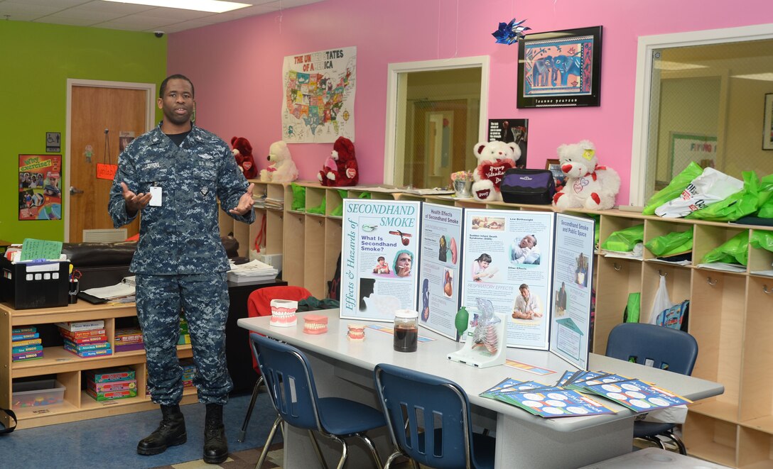 Petty Officer 1st Class Kishaun Jeffers, Naval Branch Health Clinic, Albany, here, demonstrates the affects smoking can have on teeth and lungs to a group of students at Marine Corps Logistics Base Albany’s Child Development Center. The activity was in recognition of the Campaign for Smoke-free Kids’ National Kick Butts Day, March 18.
