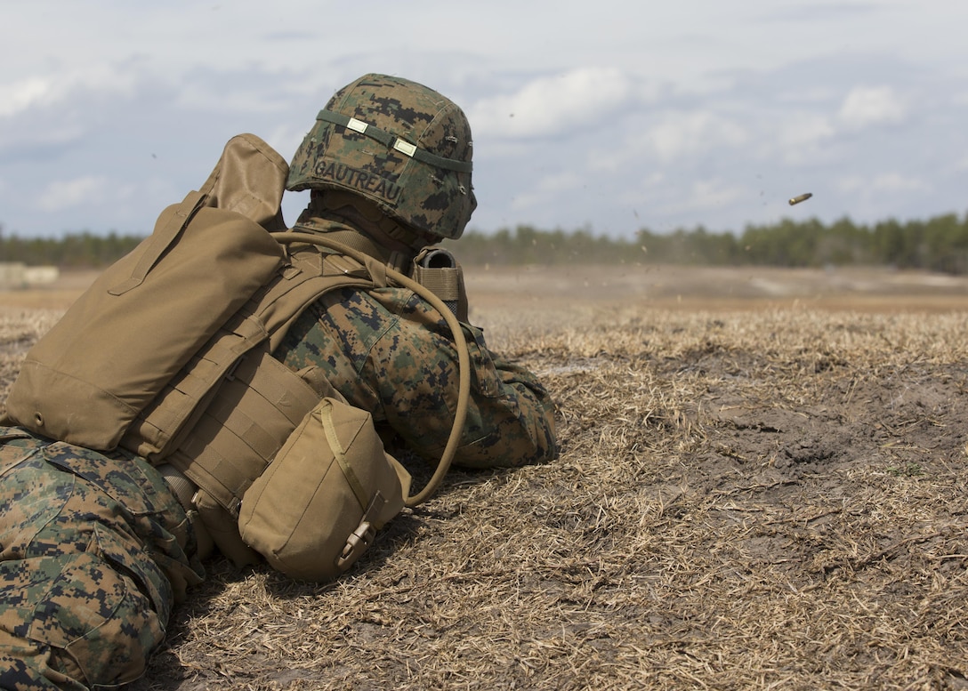 PFC Cade M. Gautreau, a rifleman with Alpha Company, 1st Battalion, 2nd Marine Regiment, sends shots down range during a field exercise aboard Camp Lejeune, N.C., March 4, 2015. Fire teams conducted a live-fire and maneuver ranges to build team cohesion and confidence. (U.S. Marine Corps photo by Lance Cpl. Olivia McDonald/Released)