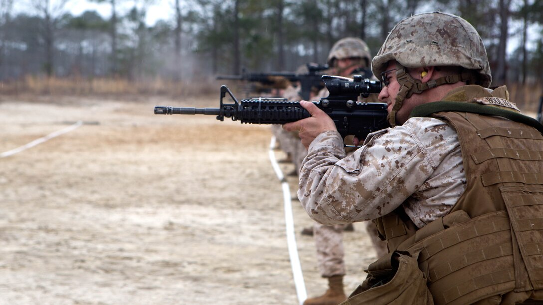 Marines with Bulk Fuel Company, 8th Engineer Support Battalion, 2nd Marine Logistics Group, engage targets during a table-three shooting qualification aboard Marine Corps Base Camp Lejeune, N.C., March 19, 2015. The table is a yearly requirement for Marines in certain units, and it assists in teaching them how to fire on targets while maneuvering. 
