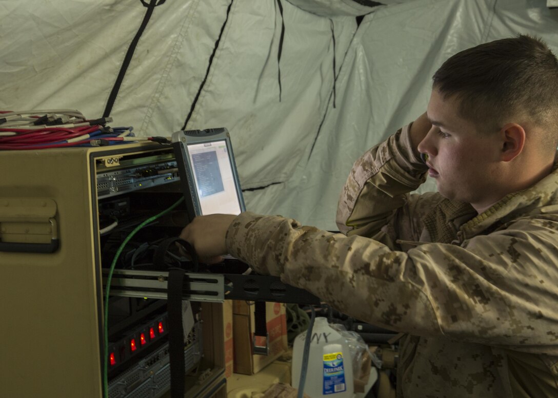 Cpl. Blake C. Maynardstarky, a field wireman with Alpha Company, 8th Communication Battalion, II Marine Expeditionary Force, checks data traffic flow and signal on the computer network during 8th Comm.’s field exercise aboard Camp Lejeune, N.C., March 9, 2015. During this field exercise, 8th Comm. was exercising their communication capabilities in support of II Marine Headquarters Group. (U.S. Marine Corps photo by Cpl. Justin T. Updegraff/Released)
