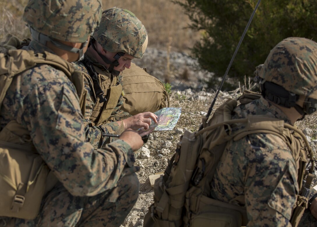 A Marine with 2nd Air Naval Gunfire Liaison Company, II Marine Expeditionary Force Headquarters Group, finds his coordinates using a protractor and a map before calling it in during a call for fire exercise aboard Camp Lejeune, N.C., March 17, 2015. This exercise prepares Marines for future deployments by ensuring they know the standard reporting procedures and how to conduct a call for fire either through mortars, artillery or air support. (U.S. Marine Corps photo by Cpl. Justin T. Updegraff/ Released)