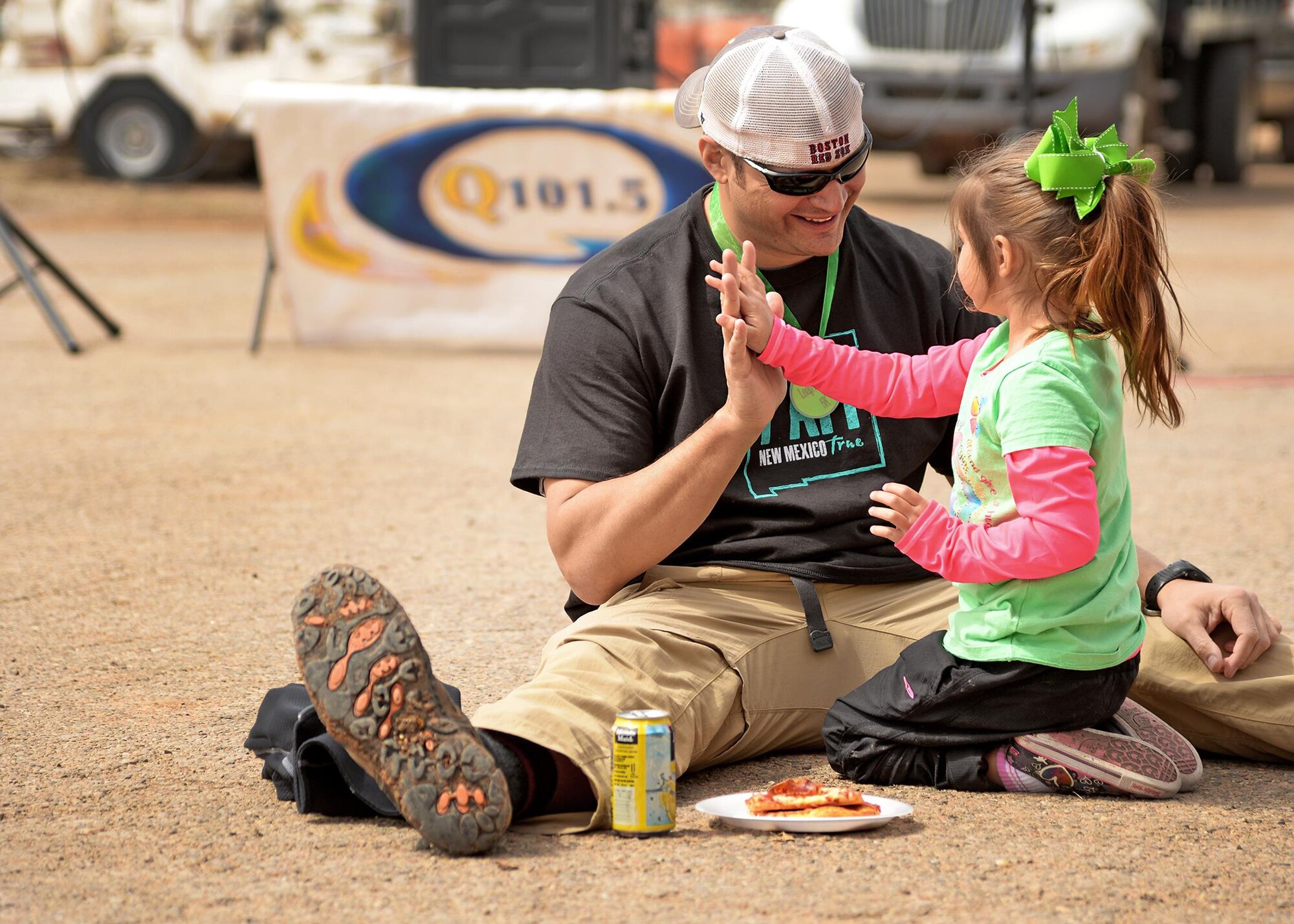 U.S. Air Force Lt. Col. Lance Rosa-Miranda, 551st Special Operations Squadron commander, receives a high-five from his daughter after his second place victory at the Great American Cleanup March 21, 2015 at the Parks and Recreation facility in Clovis, N.M. Rosa-Miranda and his team of 25 Air Commandos from the 551st SOS gathered 99 bags of trash during the event. (U.S. Air Force photo/Airman 1st Class Chip Slack)