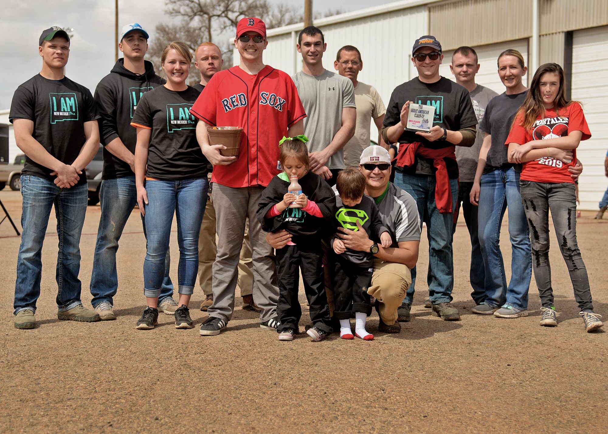 U.S. Air Force Lt. Col. Lance Rosa-Miranda, 551st Special Operations Squadron commander, poses with his team after being announced the Great American Cleanup’s second place winners March 21, 2015 at the Parks and Recreation facility in Clovis, N.M. The 551st SOS gathered 99 bags of trash and helped give back to their community. (U.S. Air Force photo/Airman 1st Class Chip Slack)
