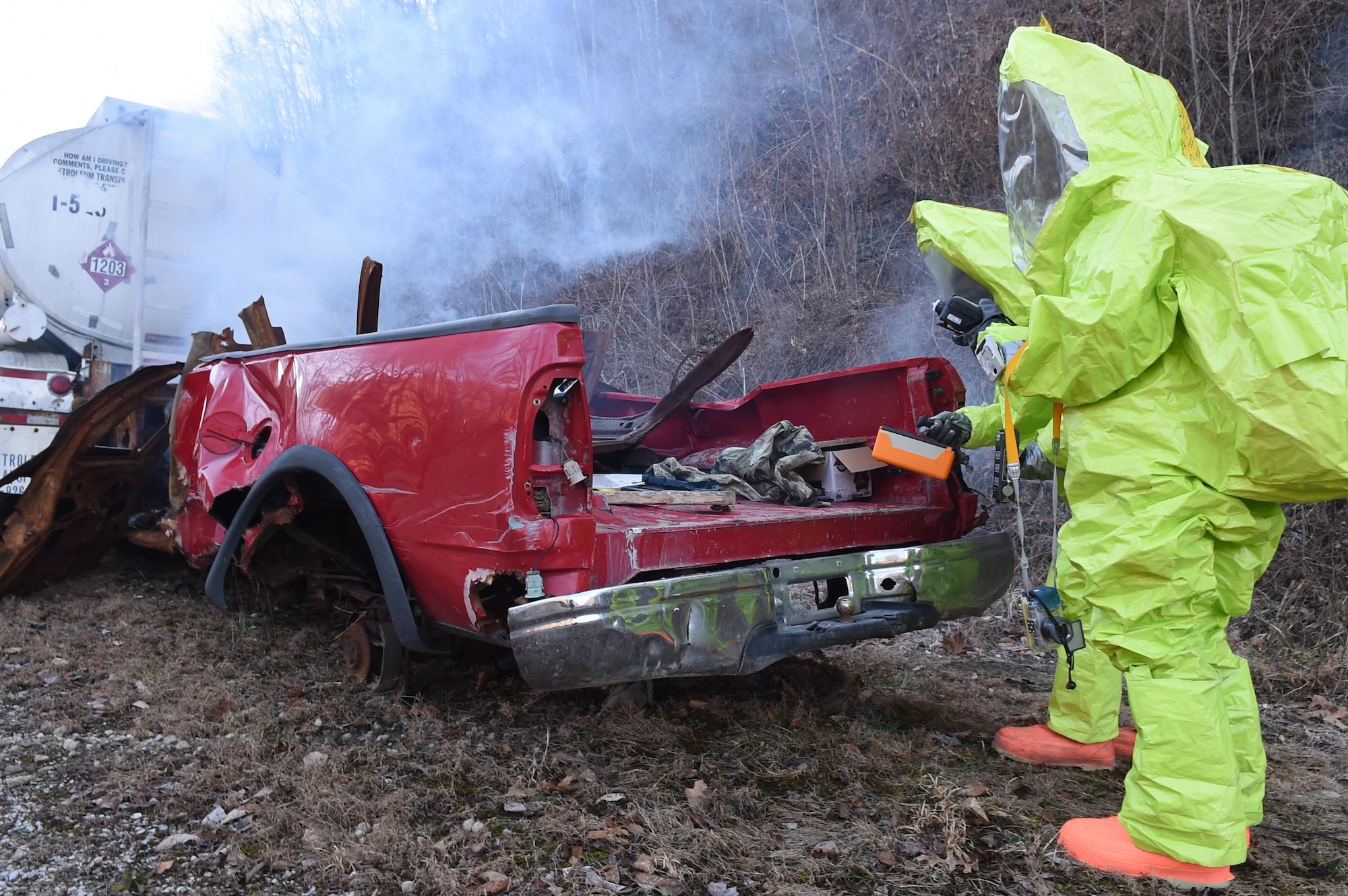 Senior Airman Tony Pauline and Airman Marlene Zeledon scan and photograph a chemical spill for a training exercise March 17, 2015, at the Center for National Response in Gallagher, W.Va. This training is part of the annual Black Flag exercise for first responders. Pauline is a bioenvironmental engineering technician with the 779th Aerospace Medical Squadron and Zeledon is an emergency management specialist with the 11th Civil Engineer Squadron, and both are assigned to Joint Base Andrews, Md. (U.S. Air Force photo/Senior Airman Joshua R. M. Dewberry)