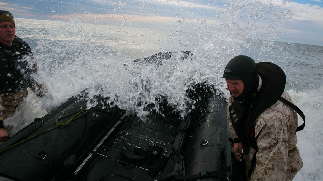 Marines with 2nd Reconnaissance Battalion, 2nd Marine Division fight the waves of the Atlantic Ocean during an amphibious beach exercise at Onslow beach, aboard Marine Corps Base Camp Lejeune, N.C., March 19, 2015. The Marines started the final training event March 20 from Courthouse Bay, utilizing the navigational portion in the Atlantic Ocean, and from there, they moved into the beach landing site at Onslow Beach. 