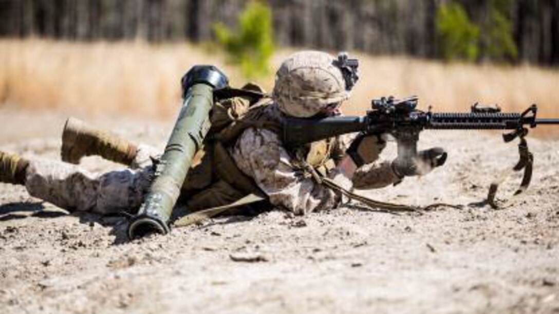 A Marine with Charlie Company, 1st Battalion, 6th Marine Regiment conducts a speed reload on his M16 A-4 service rifle during a live-fire, fire-team attack range exercise aboard Camp Lejeune, N.C., March 18, 2015. One fire-team at a time conducted the attack, advancing across a field while providing suppressive fire and utilizing various munitions. 